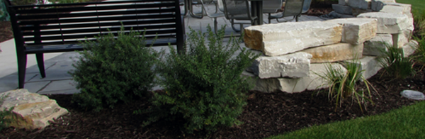 commercial hardscape with bench and retaining wall