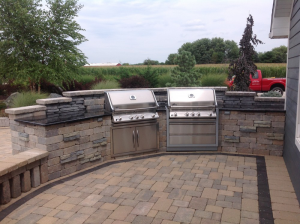 Outdoor patio area with two grills