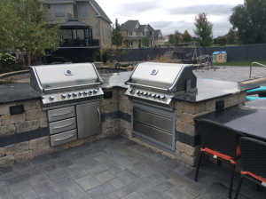 Patio area with two grills and seating