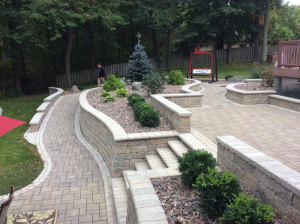 Outdoor pathway and retaining wall with built-in stairway