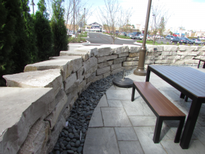 commercial landscaping stone wall around outdoor patio northwestern in